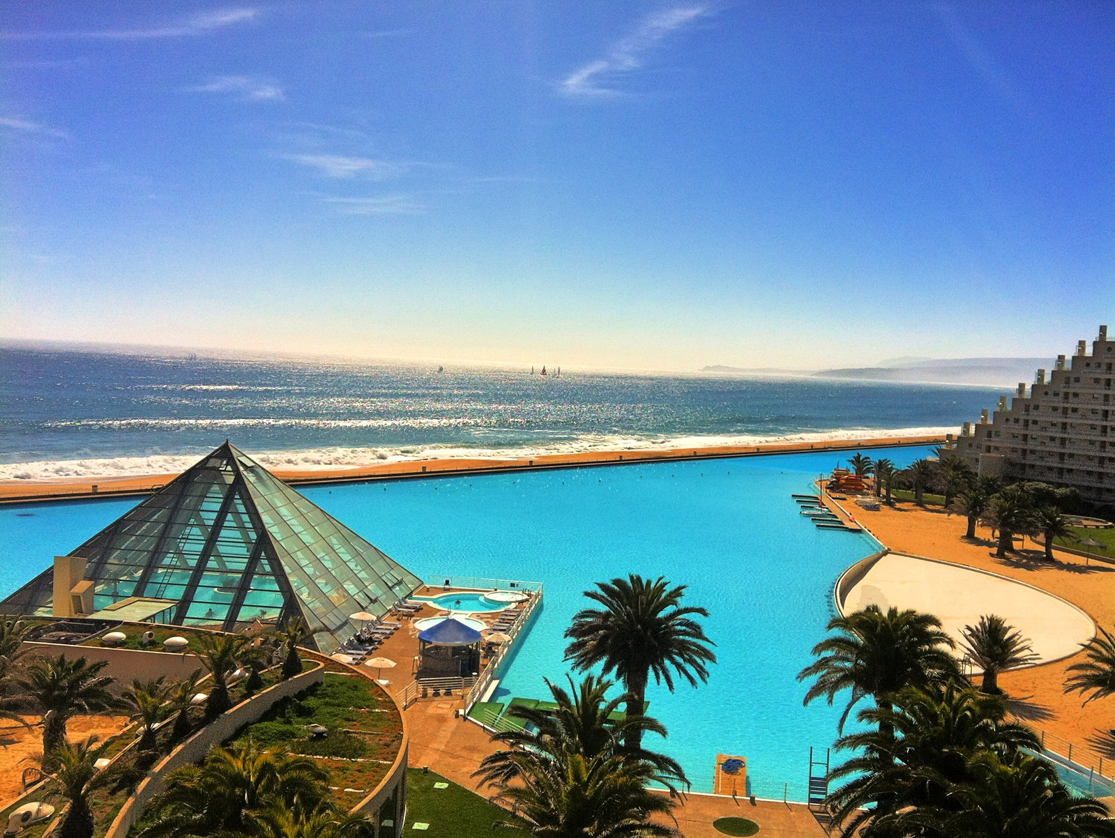 Larget swimming pool in the world on the coast of San Alfonso del Mar, Chile, in sunny day and the Pacific on the background.